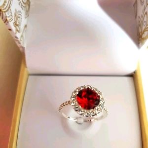 Four brand new ruby red rings